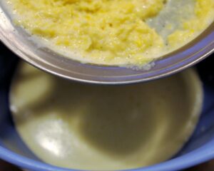 Pour the mixture over a sieve into a bowl to remove solids.