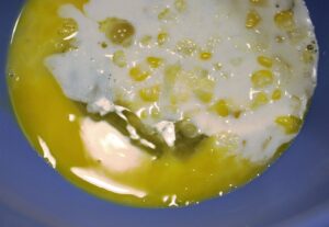 Tempering just means that you are bringing the temperature of the eggs up closer to the temperature of the hot mixture (in this case the corn and cream mixture) so that when you add the full mixture to the eggs, they don’t “scramble” or cook.